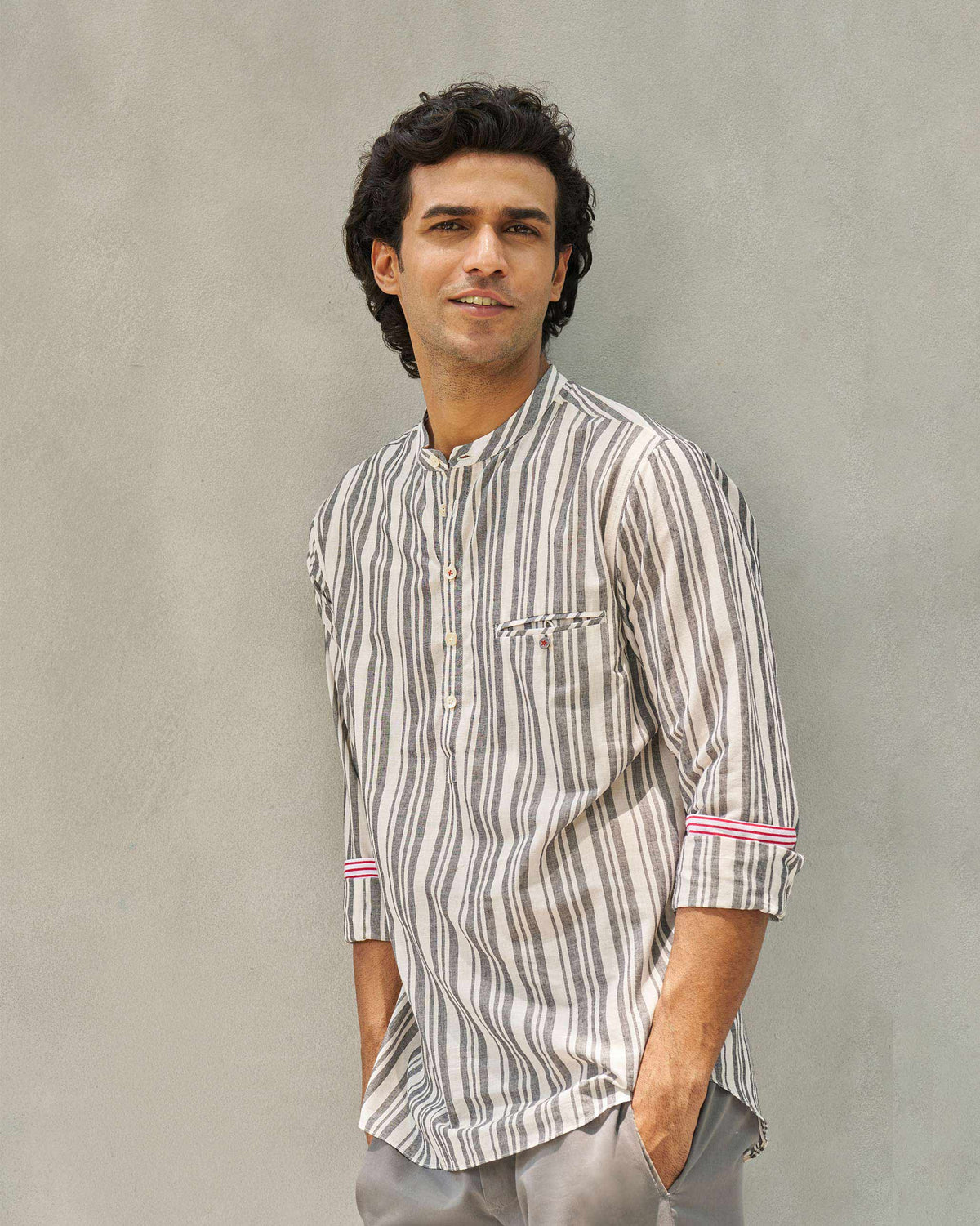 Person wearing an ivory and grey Pondicherry Shirt with a chest pocket.