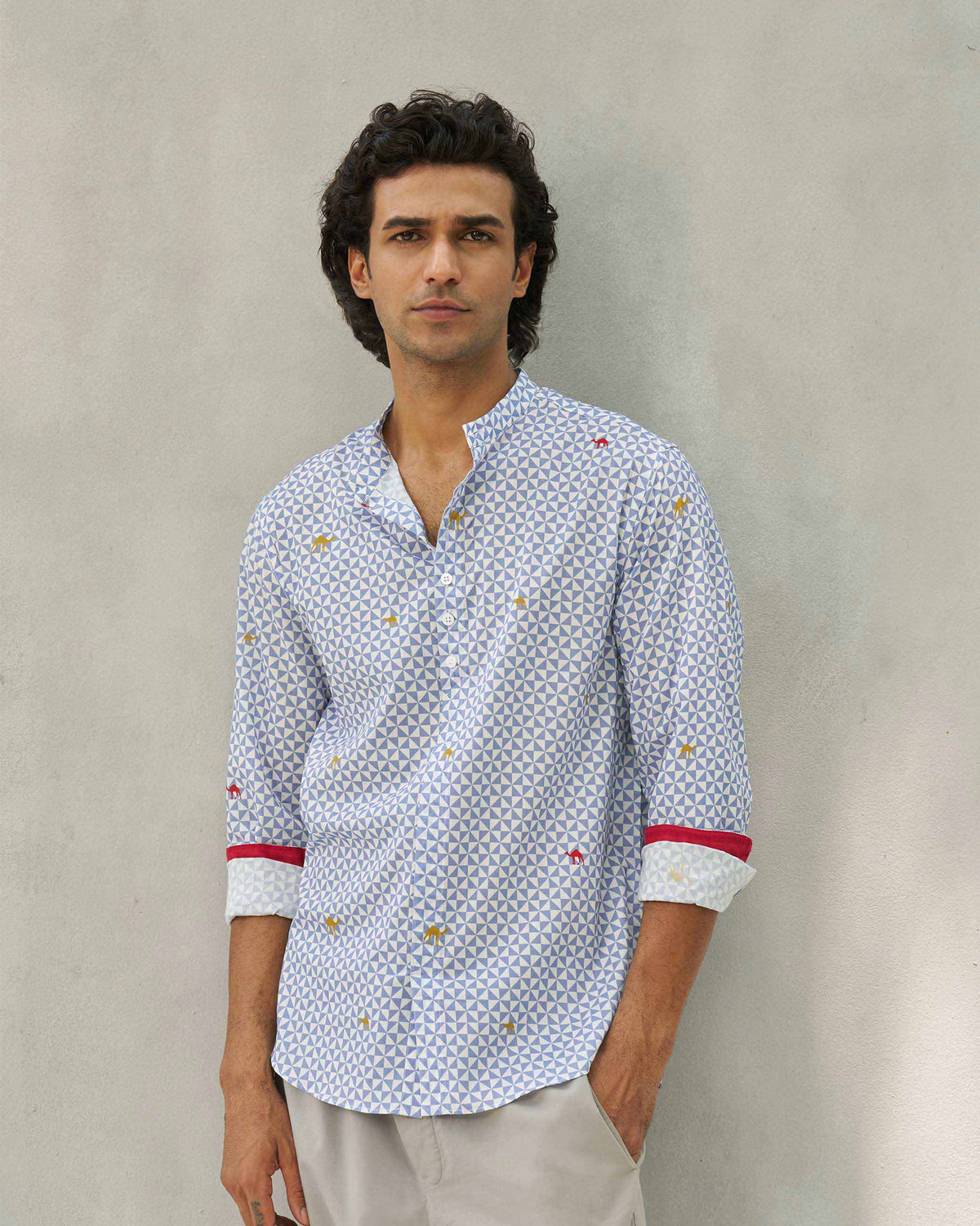 Person wearing a blue and white Angtak Shirt.