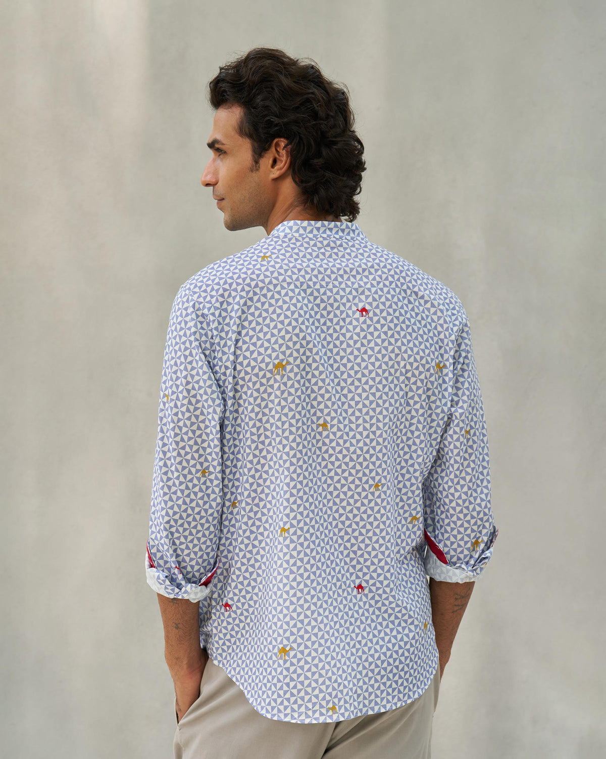 Back of a blue and white Angtak Shirt worn by a person.