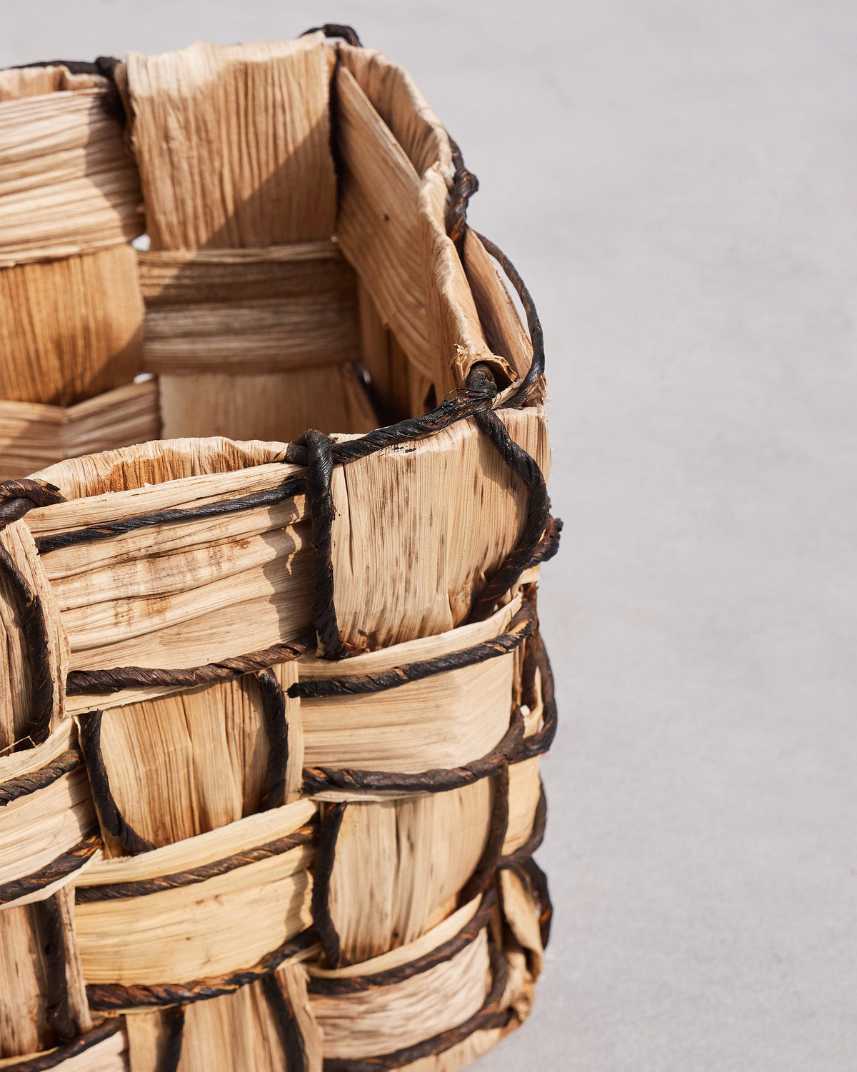 Close-up of Mosaic basket weave with dark cord outlining the squares.