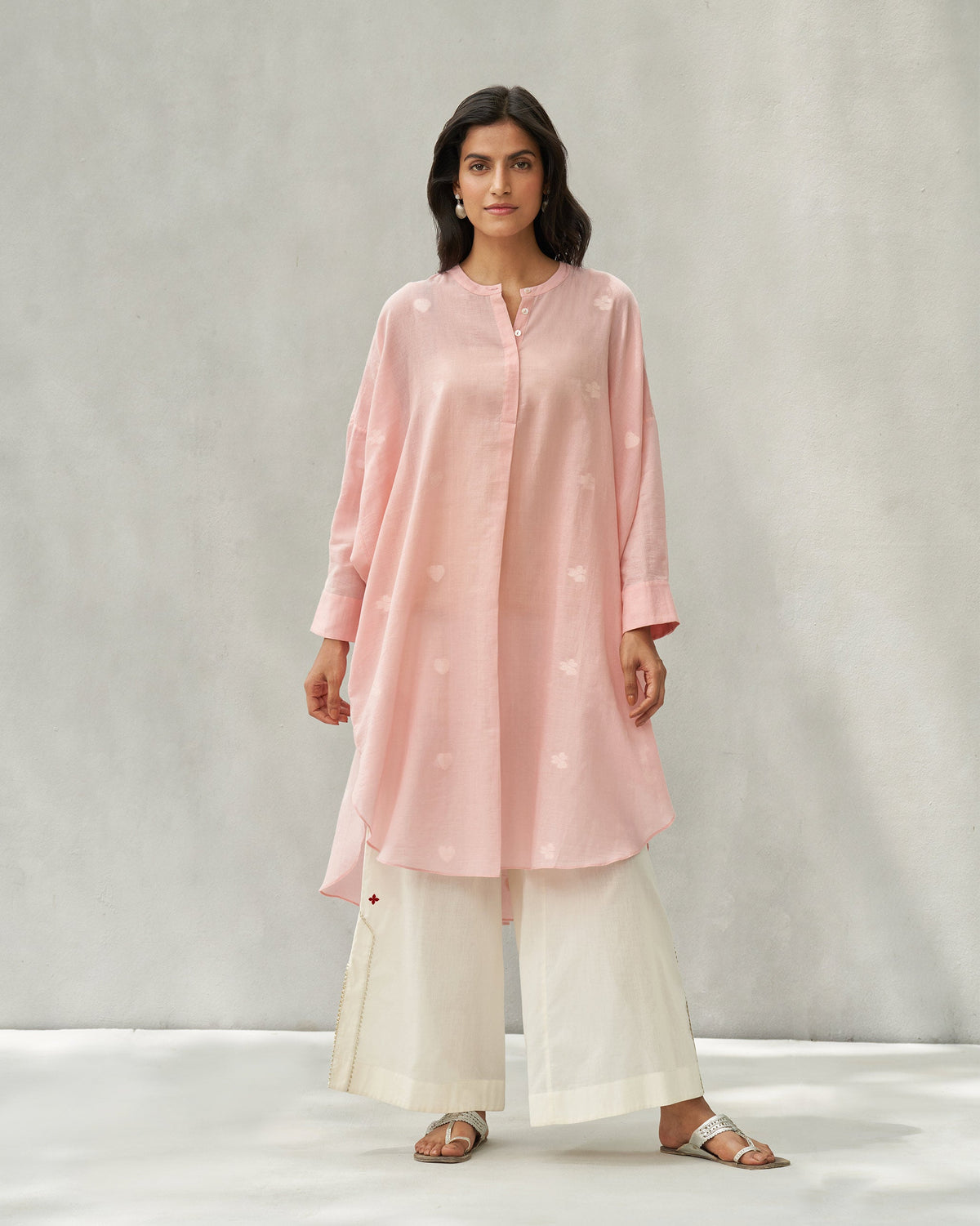 Person standing in a pink Lazy Sunday tunic with a band collar, shown full length.