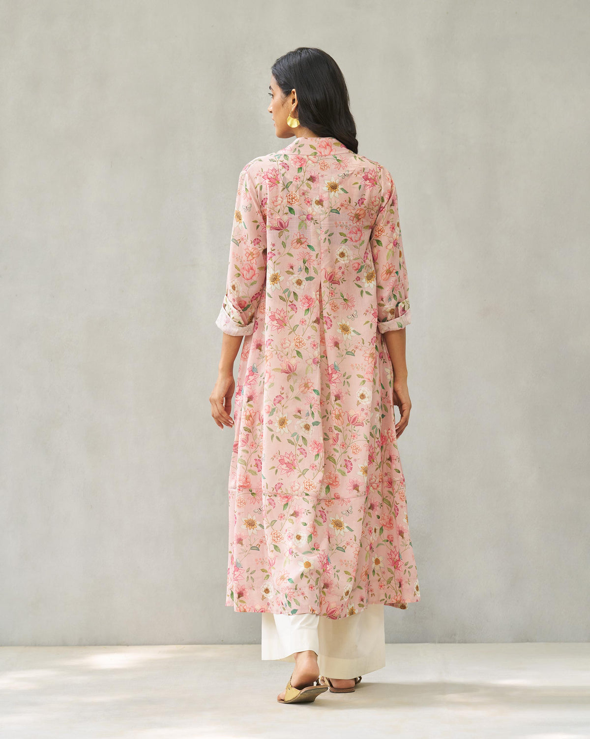 Back of the Banko V-neck kurta in a pink floral print, worn by a person.