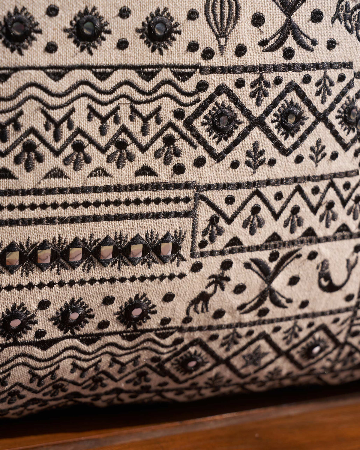 Close-up of Morocco Mosaic Cushion Cover showing black embroidery with small shiny inset pieces.