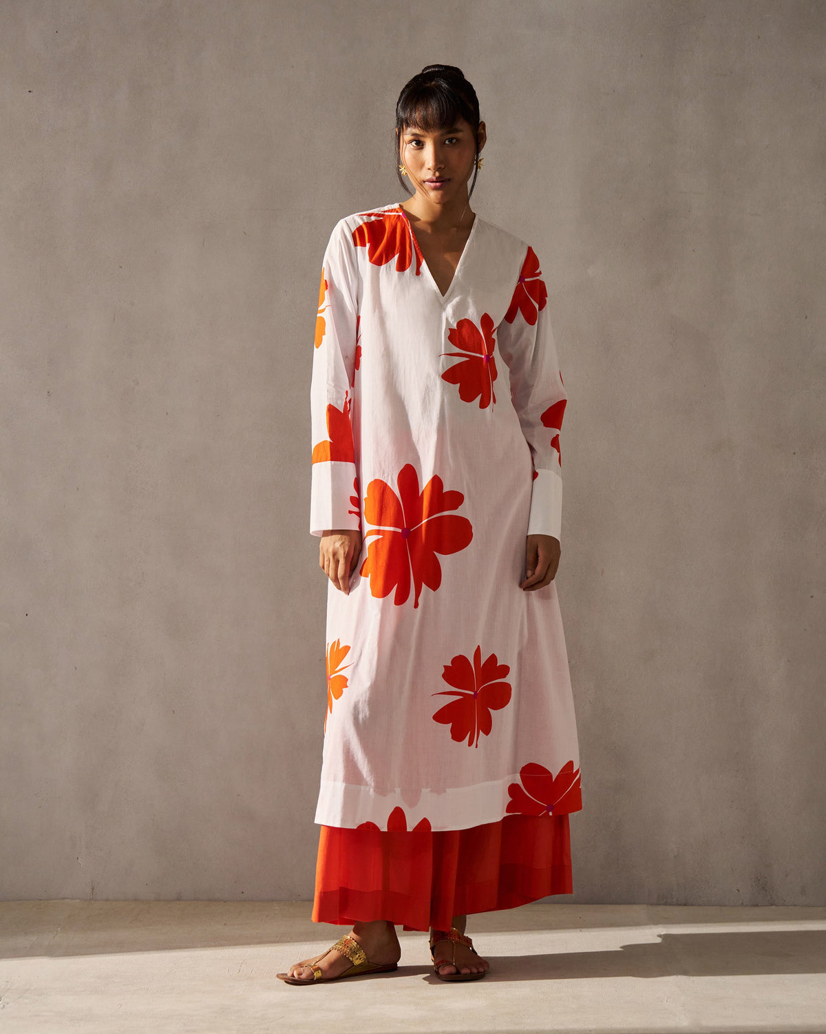 Person wearing the Flared V-neck Kurta with long sleeves and a V-neck.