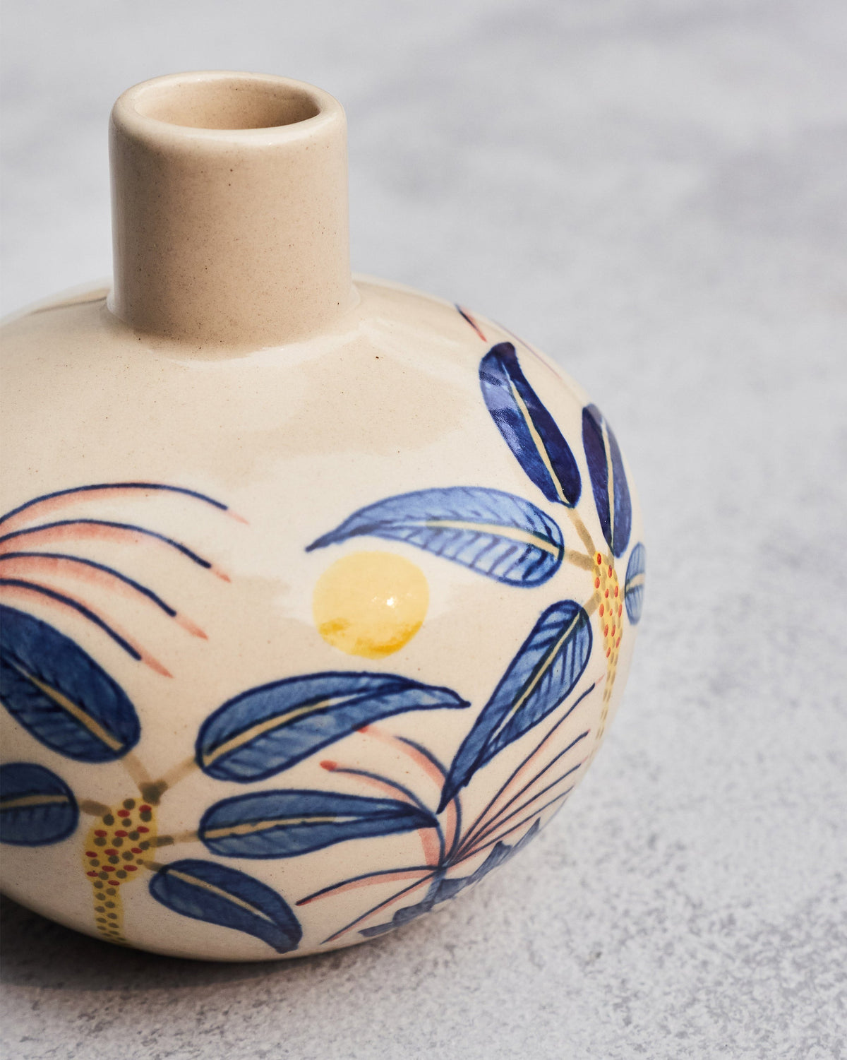 Close-up of the Palm Breeze Vase neck and shoulder with blue palm leaves and pink fronds.