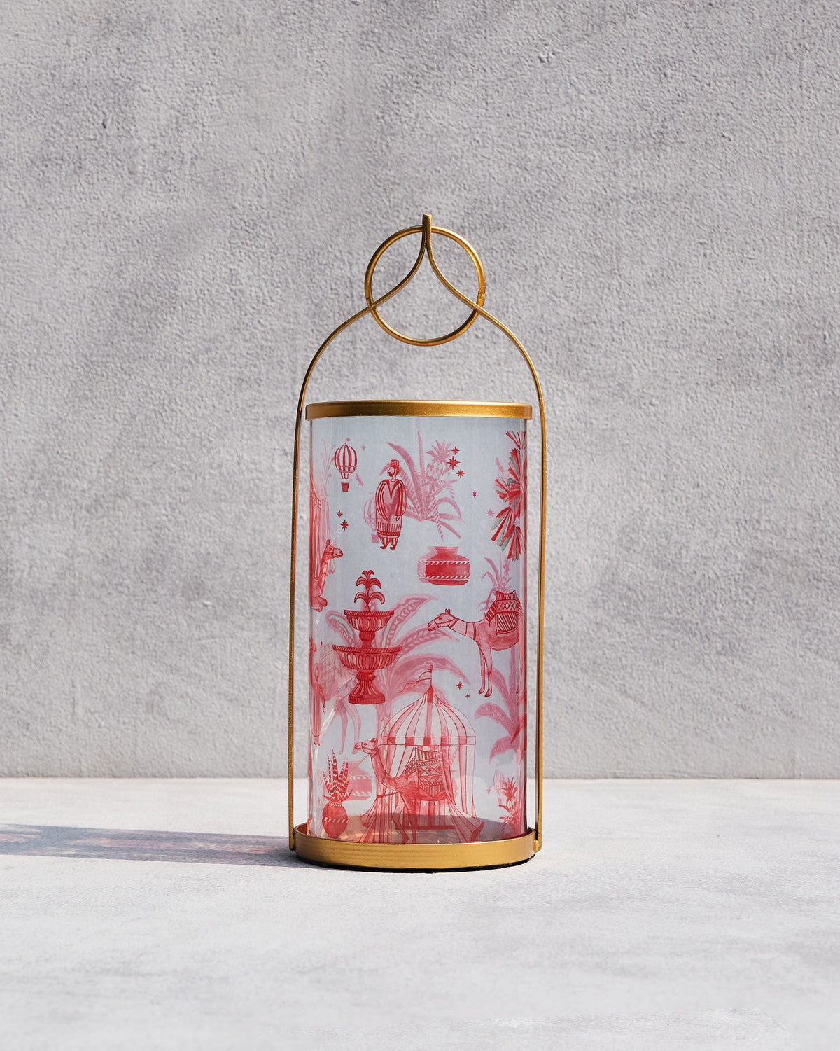 Atlas Lantern with a red toile print and a gold metal frame.
