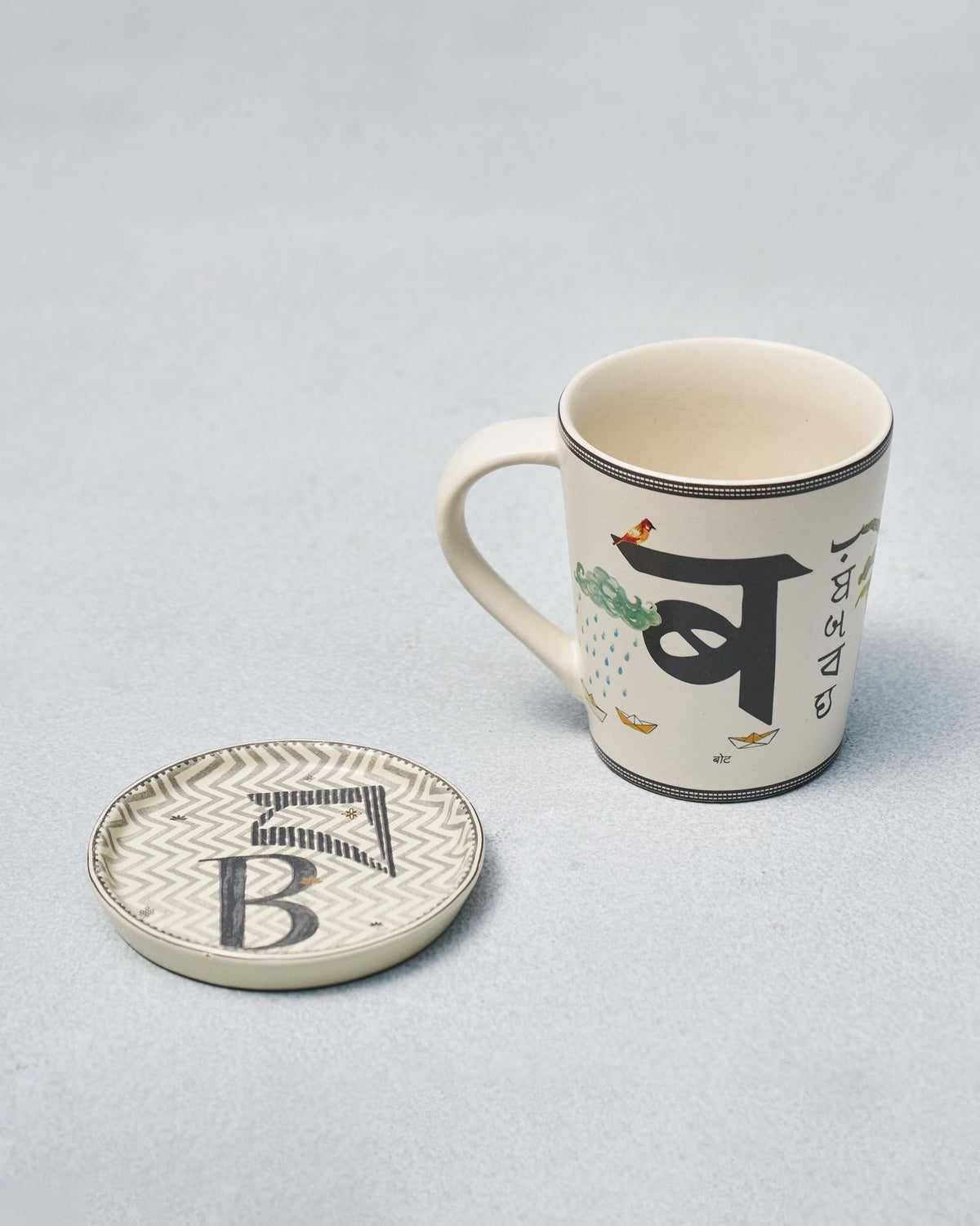 B Alphabet mug with Devanagari ब illustration beside a letter B coaster.