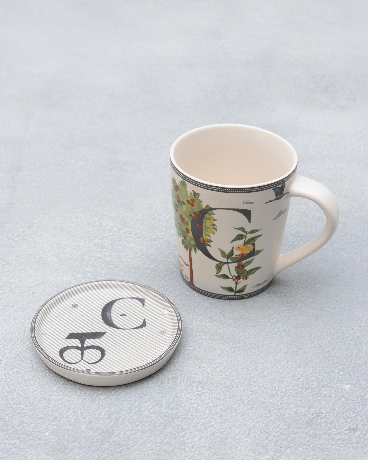 Letter C Alphabet mug with coffee-plant motifs and a matching coaster.