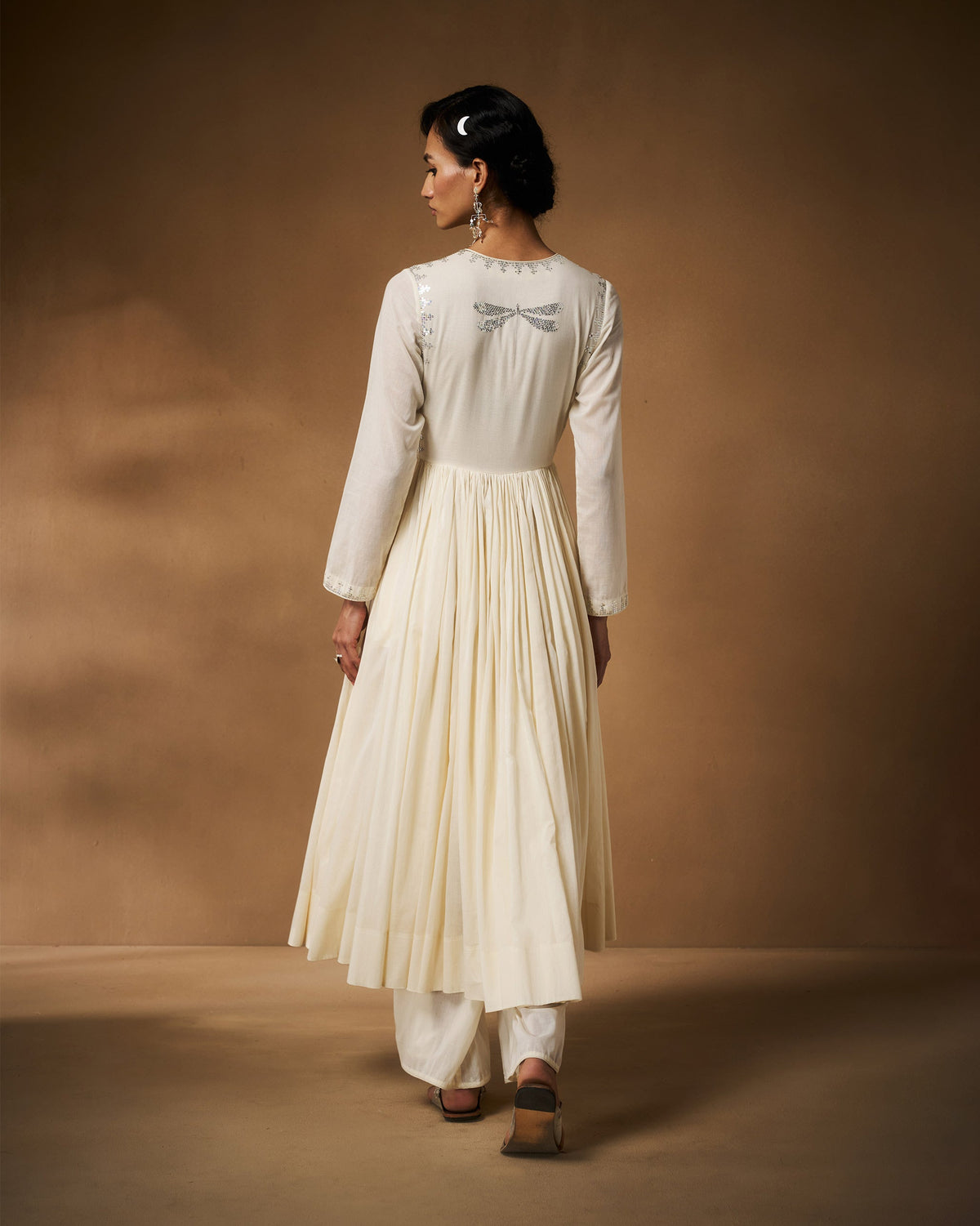 Back of an ivory Aafreen Angrakha with a silver dragonfly embroidery.