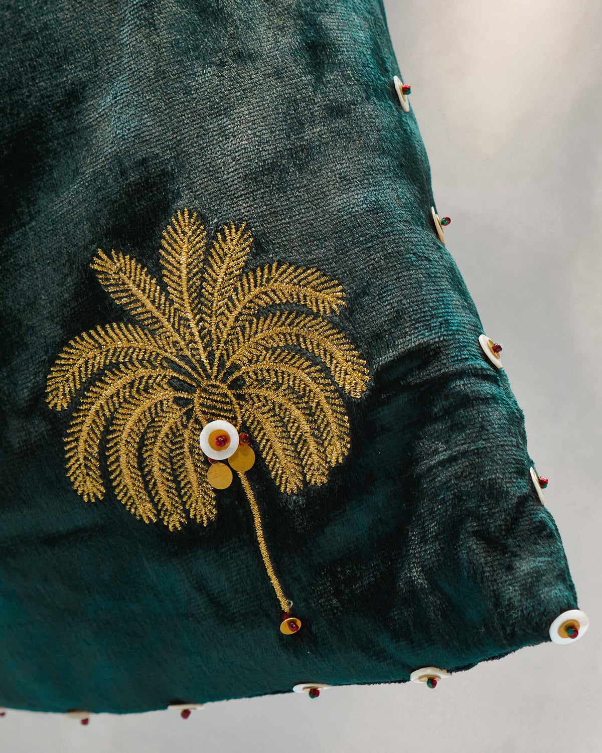 Close-up of the Tangier Tote showing a gold palm embroidery along its edge.