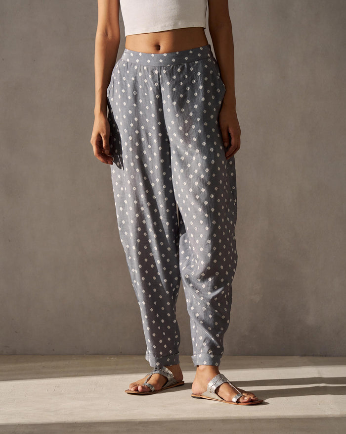 Person wearing Form Narrow Pants in grey with a white dot print.