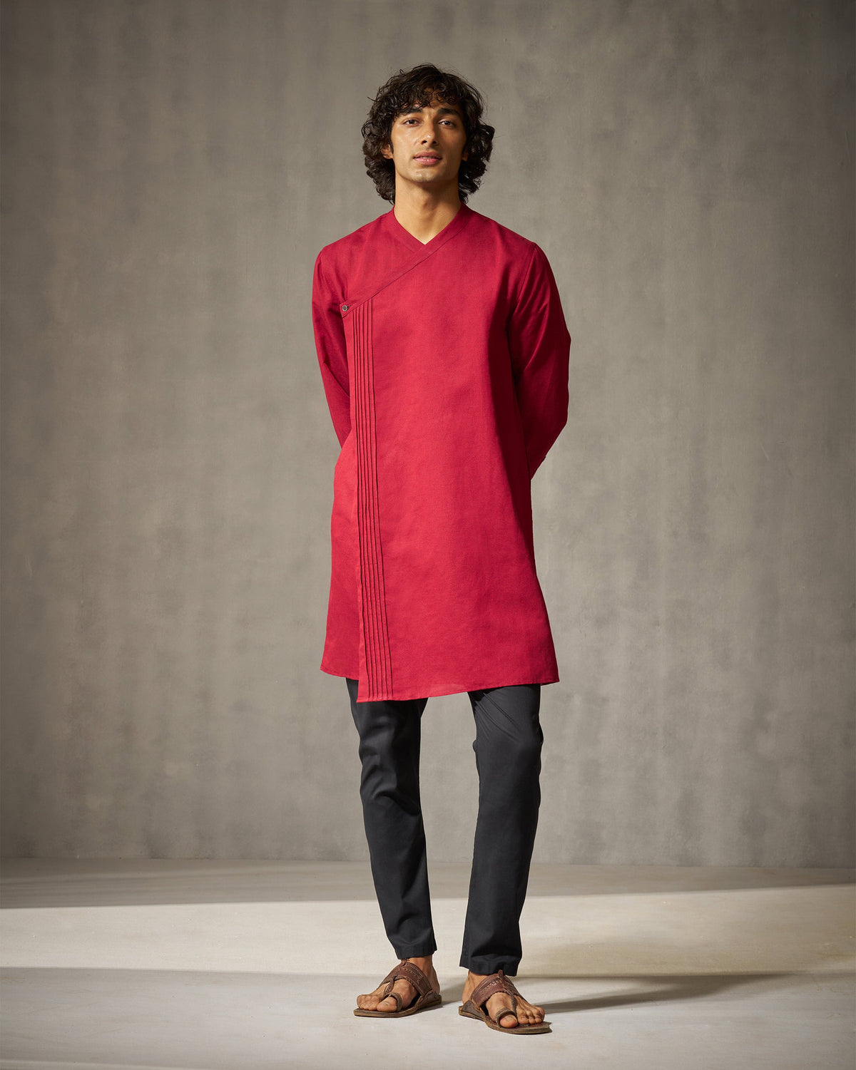 Full-length front view of a red Staple kurta with long sleeves worn by a person.