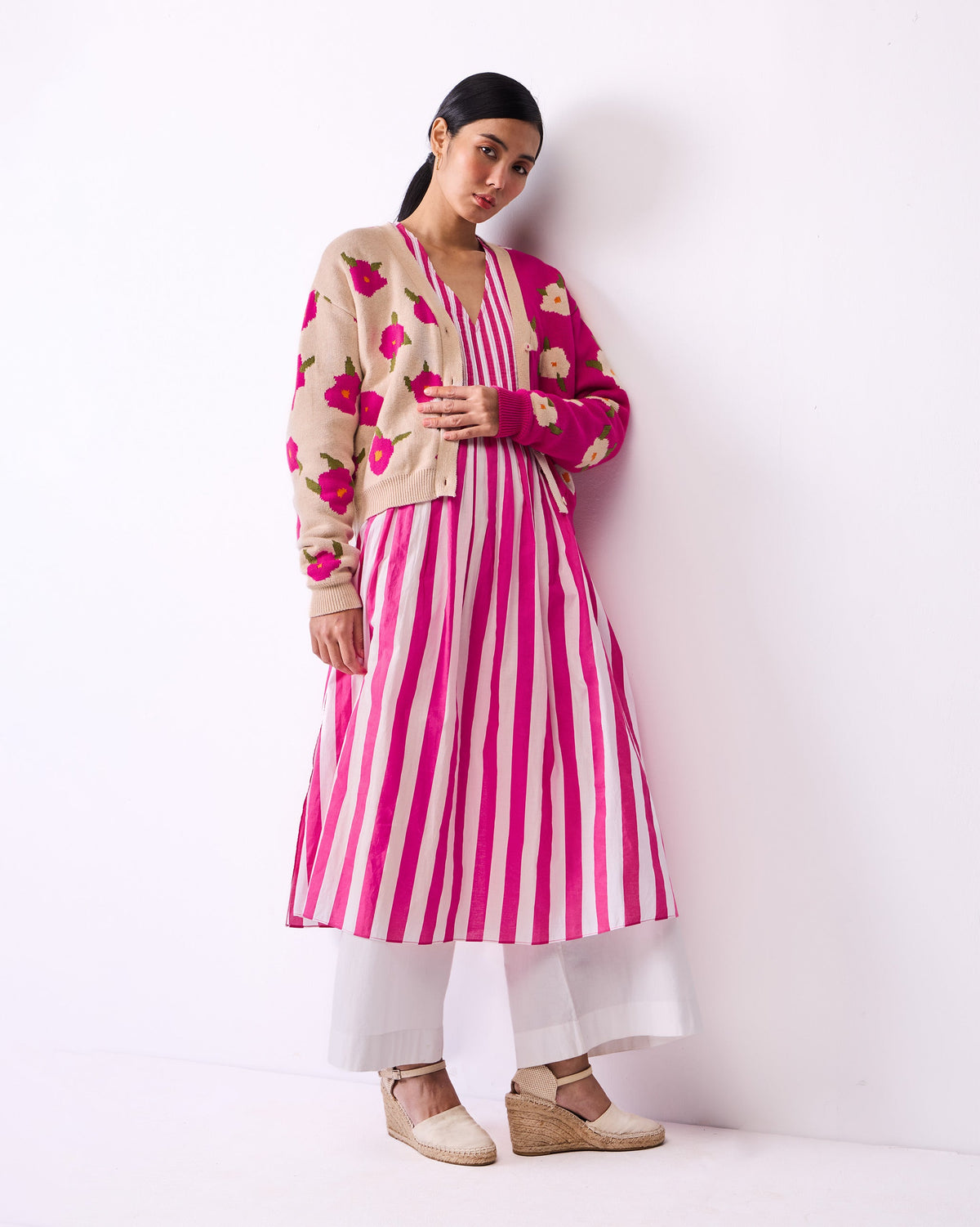 Person wearing Raven Cardigan in fuchsia and oatmeal florals.