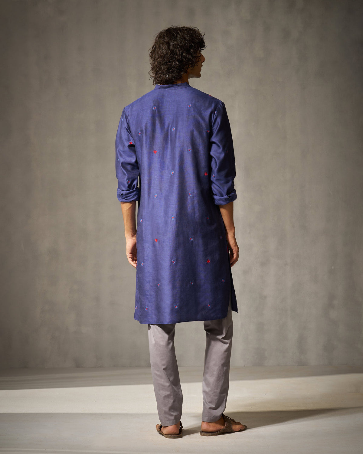 Back of a navy Neckband kurta worn by a person.