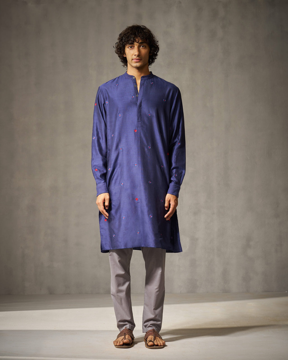 Full-length view of a navy Neckband kurta worn by a person.