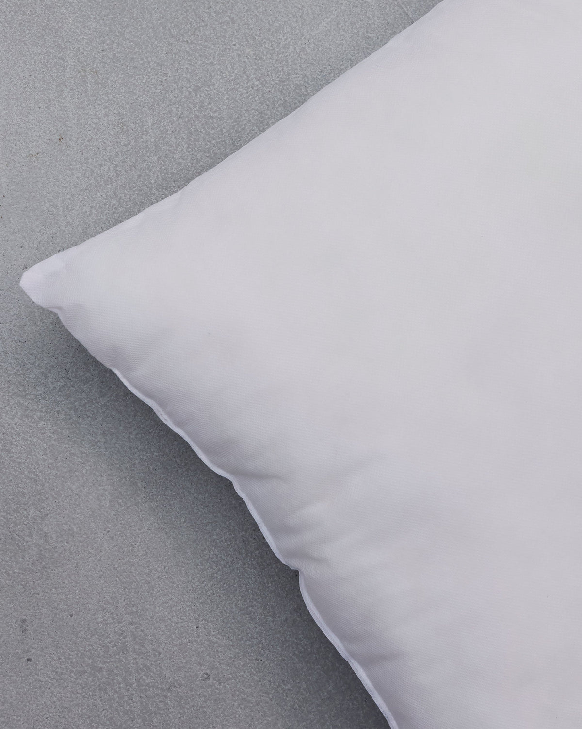 Close-up of a Cushion Filler corner showing its soft white cover.