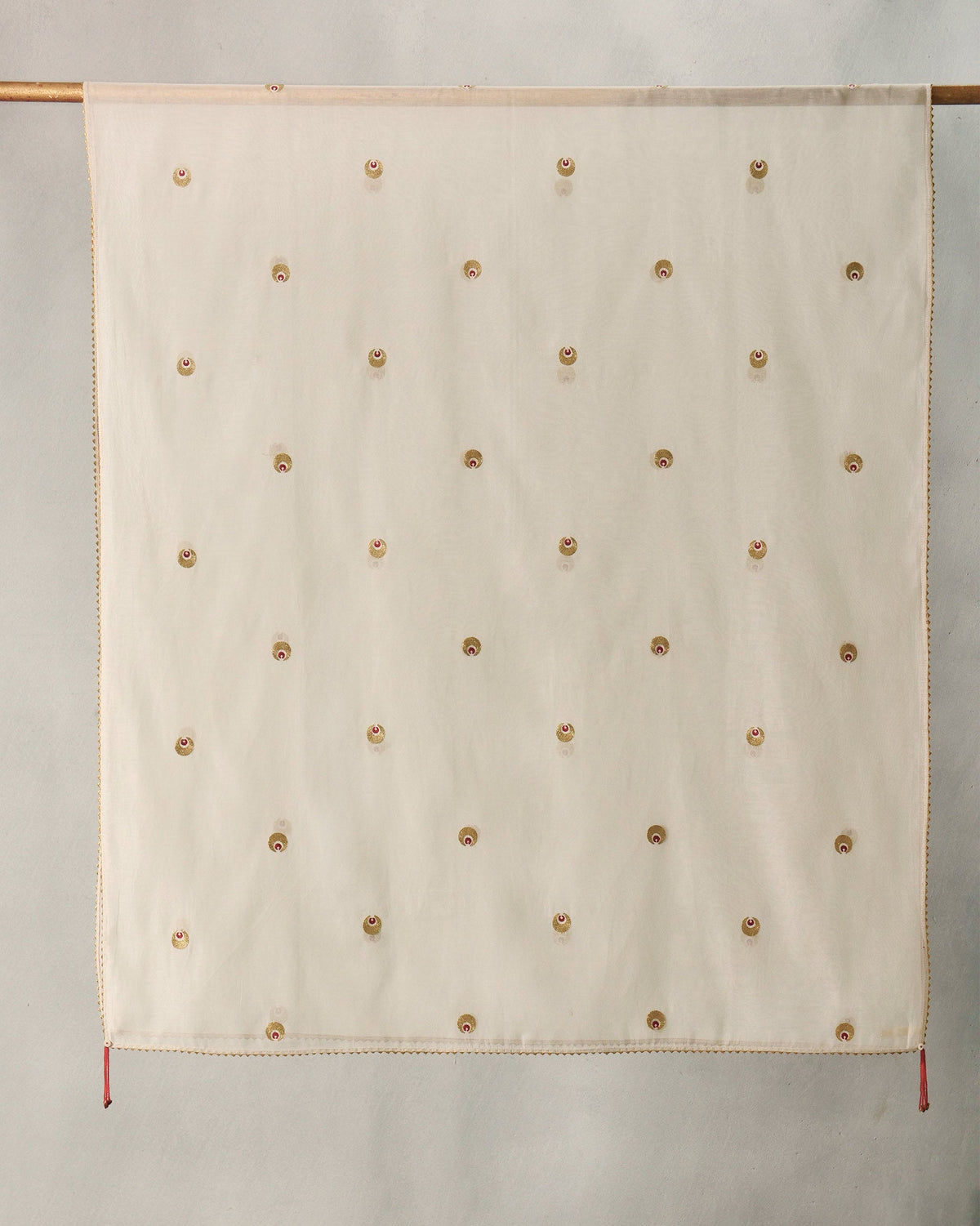 Ivory Tangier Dupatta hung flat with gold embroidered motifs in rows.