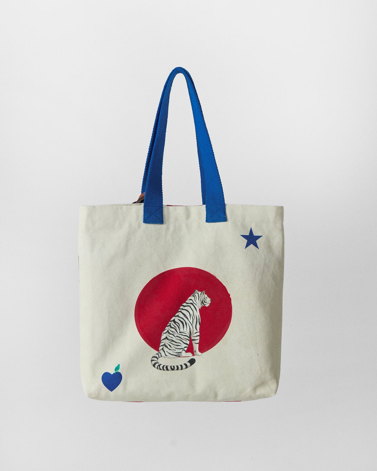 Bagan Polka Tote with red polka dots, a tiger print, and blue star and heart motifs.