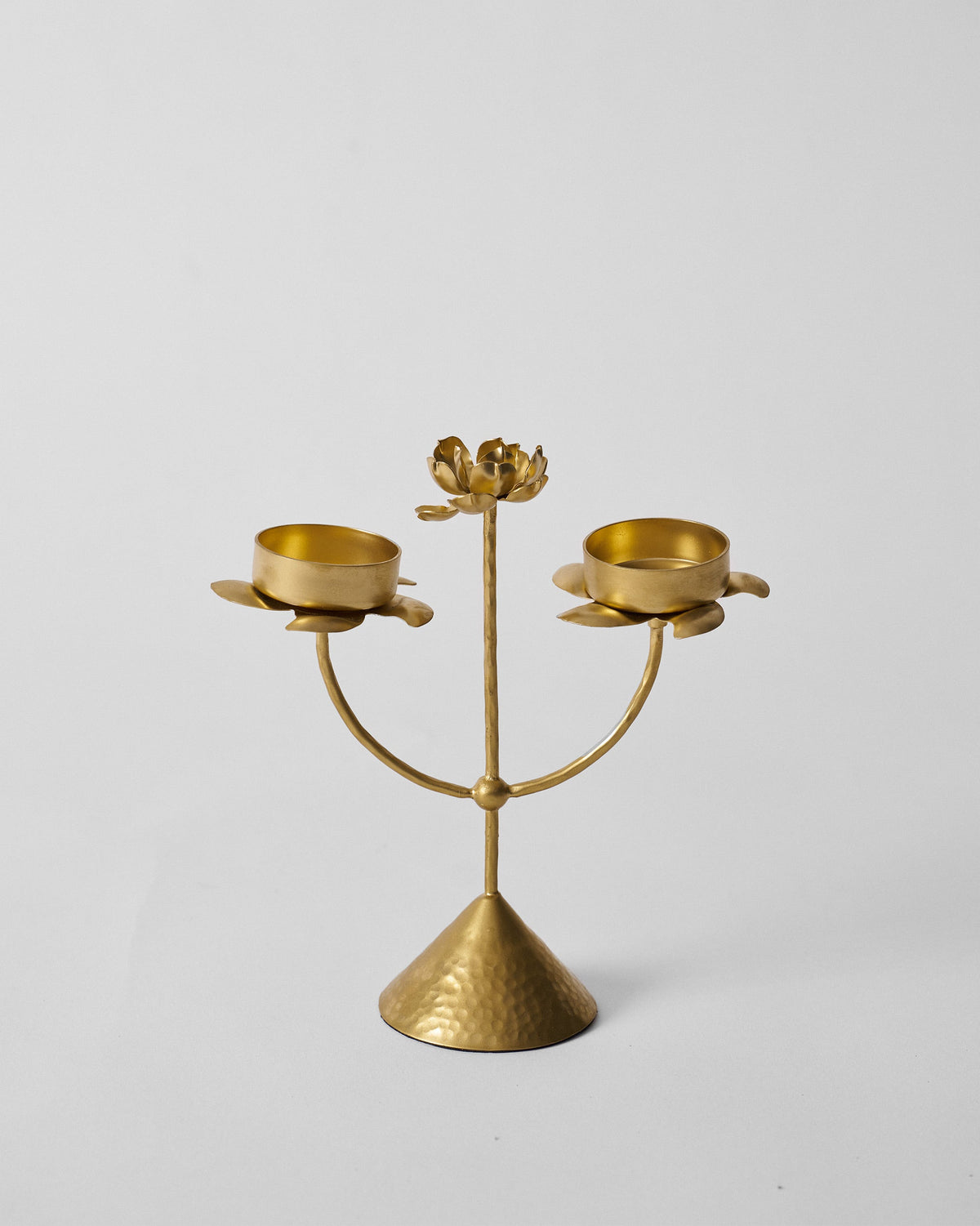 Gold Mogra bud tealight with two petal cups and a central flower.
