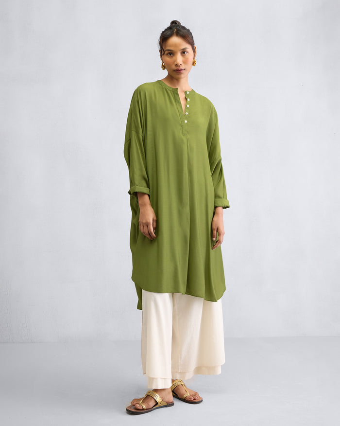 Person wearing an olive Lazy Sunday tunic with a buttoned band collar.