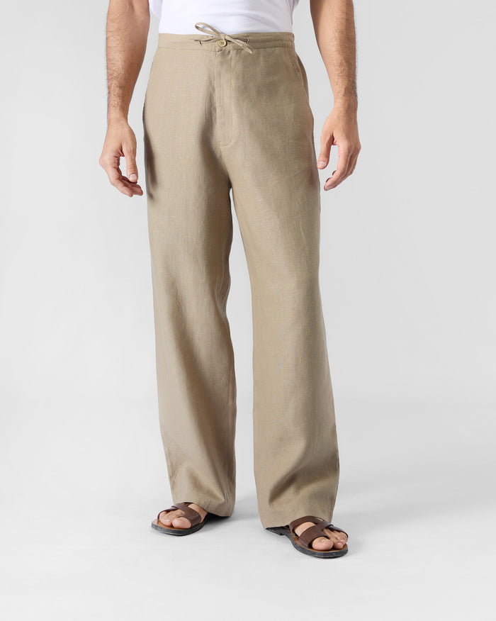 Sand Ibex trousers with a drawstring waist and straight relaxed legs.
