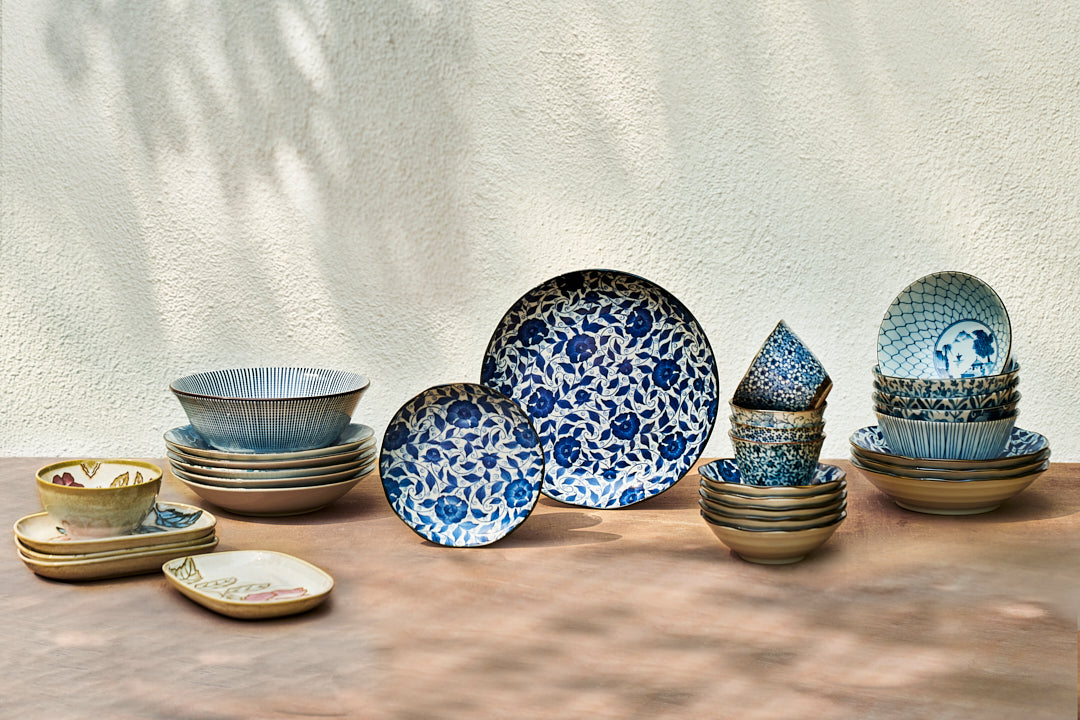 Zanzibar Katori shown with a set of blue patterned bowls and plates.